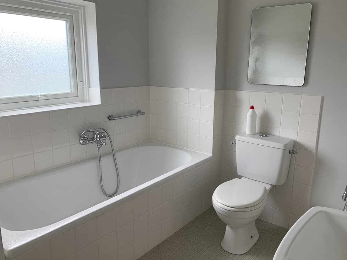 Freshly cleaned bathroom with gleaming tiles